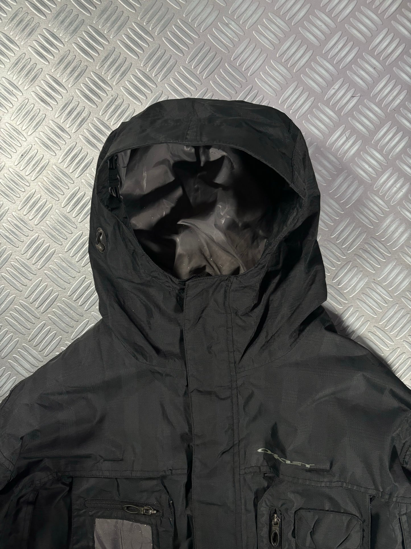 Early 2000’s Oakley Software Jet Black Transformable Front Pocket Jacket