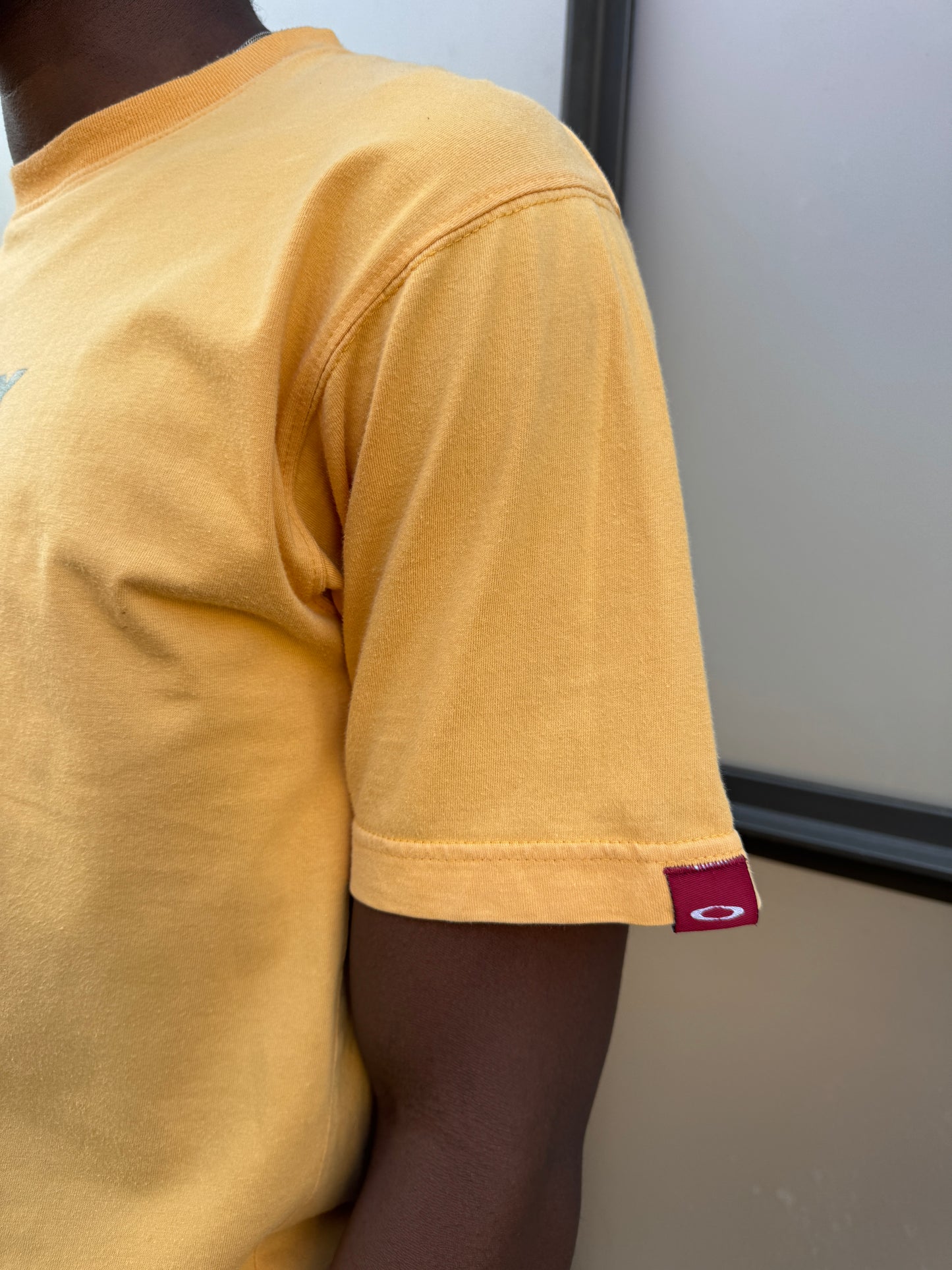 Early 2000’s Oakley Muted Yellow Graphic Tee