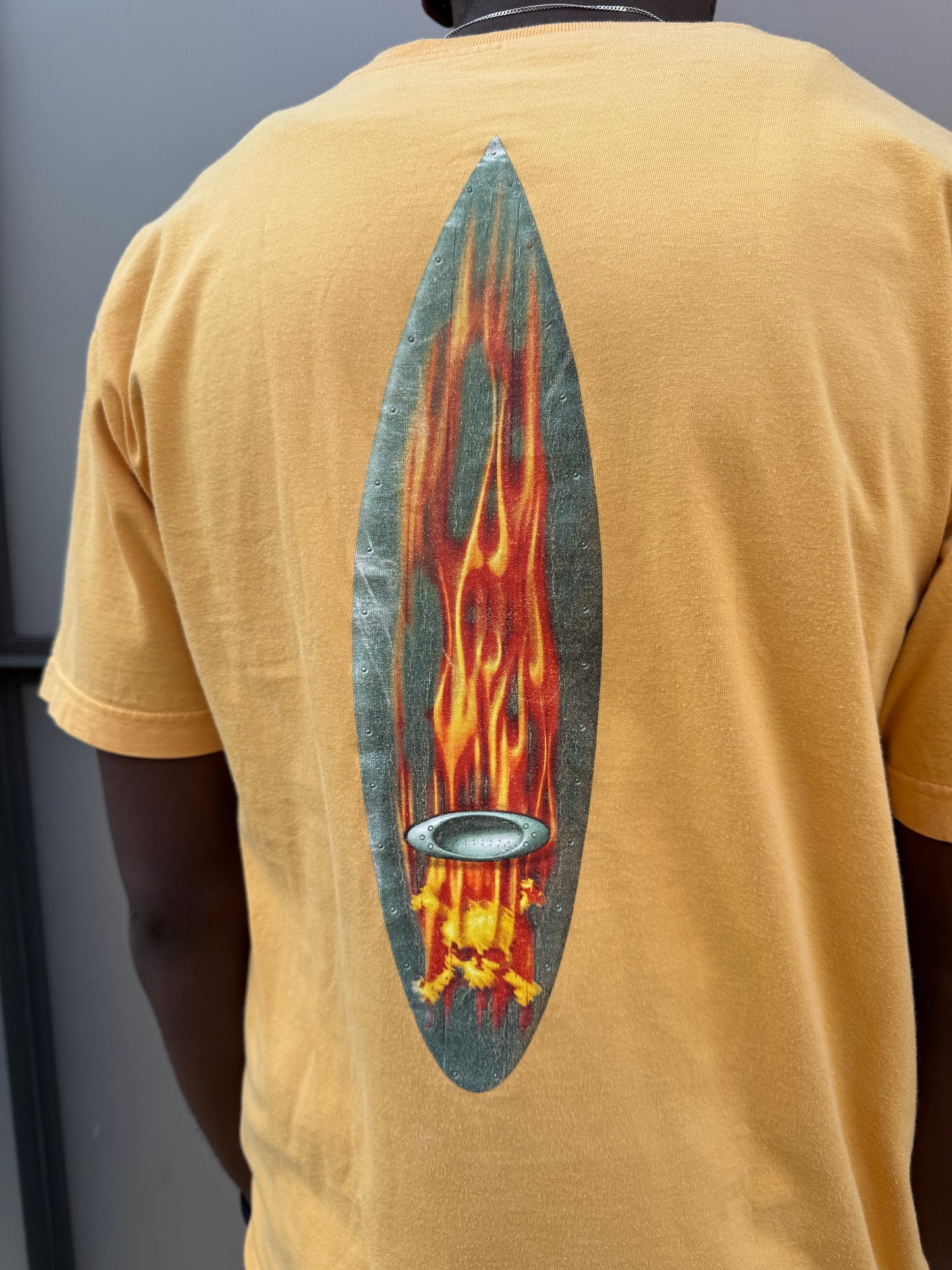 Early 2000’s Oakley Muted Yellow Graphic Tee