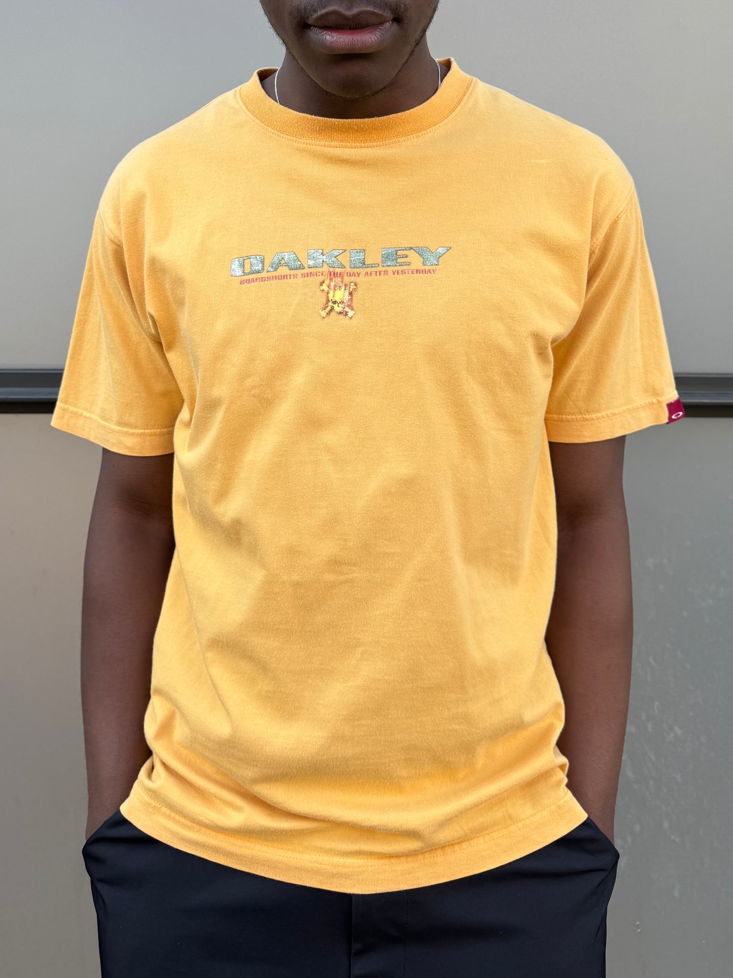 Early 2000’s Oakley Muted Yellow Graphic Tee