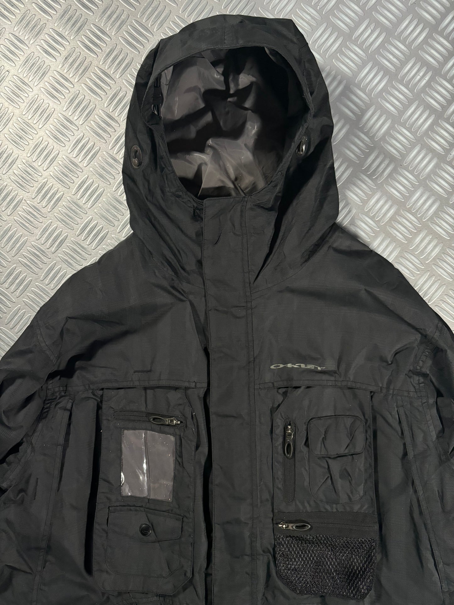 Early 2000’s Oakley Software Jet Black Transformable Front Pocket Jacket