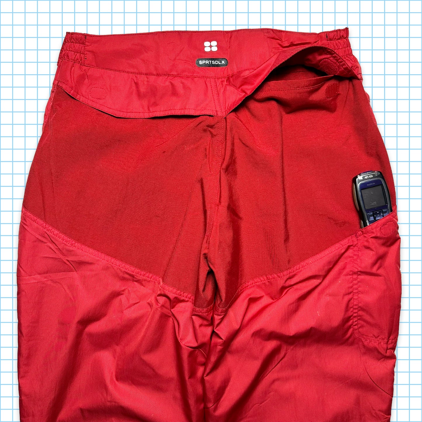 Nike SPRTSDLX Pantalon de survêtement à panneaux rouges - Taille 32-36"