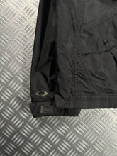 Load image into Gallery viewer, Early 2000’s Oakley Software Jet Black Transformable Front Pocket Jacket