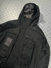 Load image into Gallery viewer, Early 2000’s Oakley Software Jet Black Transformable Front Pocket Jacket