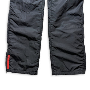 SS99' Prada Sport Pantalon de survêtement en nylon rembourré noir jais - Taille 32"
