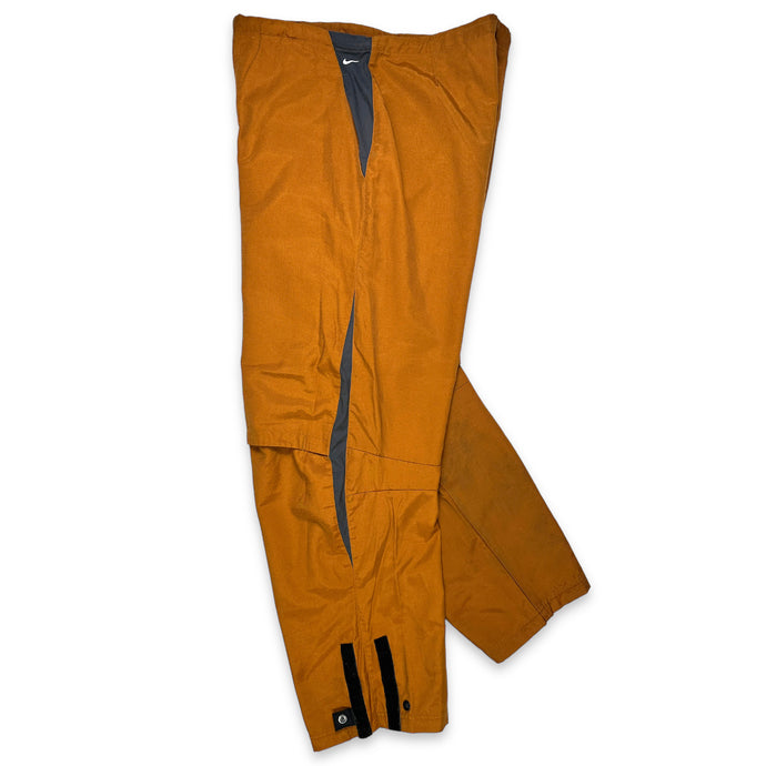 Nike Pantalon technique articulé orange brûlé/gris - Taille 34/36